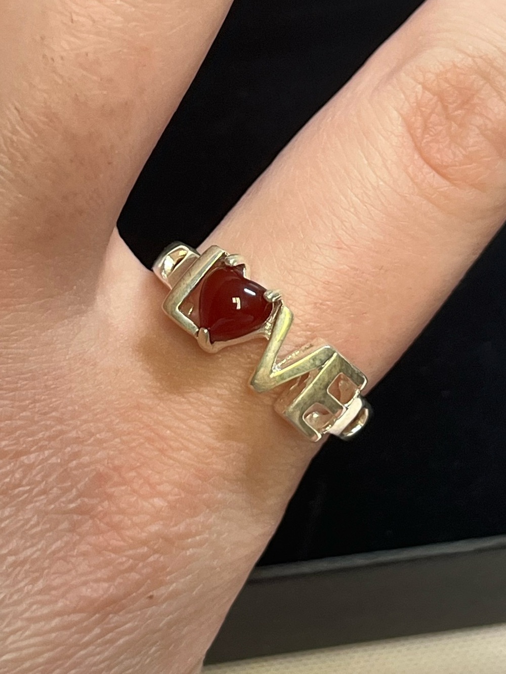 Sterling silver LOVE ring. Stamped 925
Size 8.5. Excellent condition